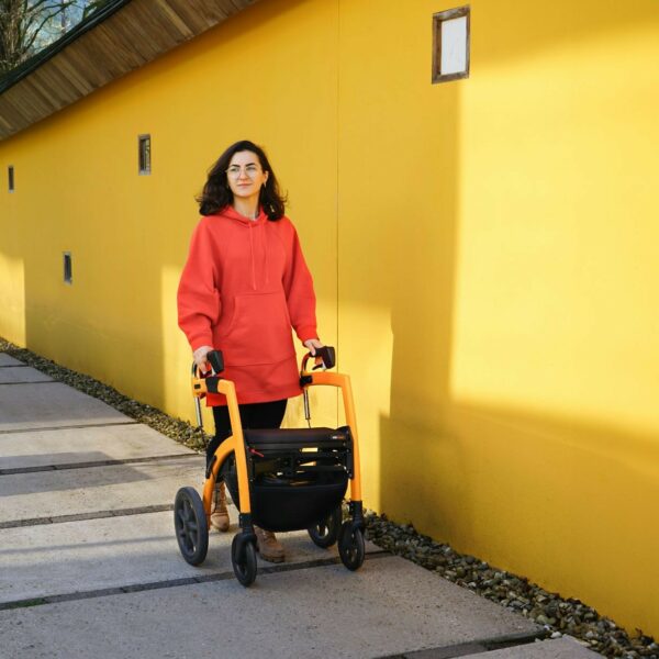 Lady walking with the help of a walker