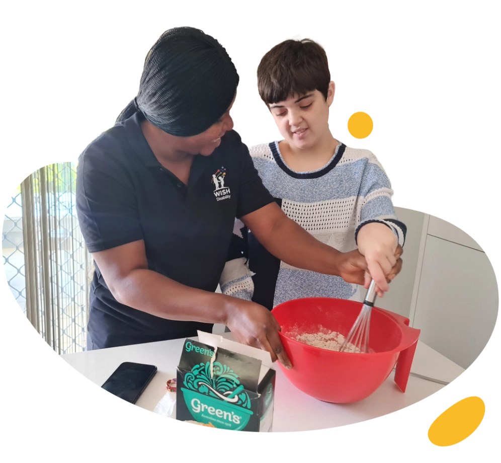 A woman and a boy are mixing ingredients in a bowl.